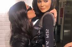 kylie kourtney kardashian smooch eerily lays