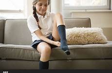 socks girl wearing sitting putting stock sofa getting sock dressed young while offset child boy questions any wear his