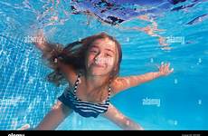underwater swimming girl cute water diving alamy under clear shoot stock