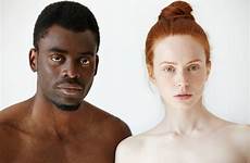 man woman african looking caucasian standing shirtless mixed race interracial couple beautiful headshot portrait camera serious young male people expression