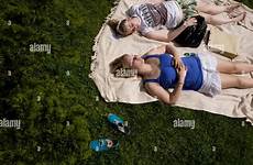 sunbathing girls grass green blanket two lawn stock alamy teenage