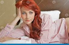 bed woman red redhead laying young beautiful sexy female looking seductive haired viewer relaxes wearing shirt men stock preview