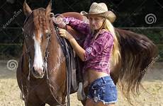 cowgirl blond girl ready horse stock