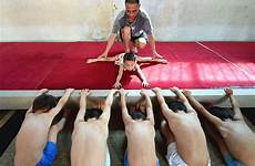 young tiny gymnastics camp children school china boy bent drilled teacher girl their chinafotopress boot getty via paces putting through