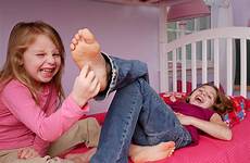 tickle feet tickling stock girl female old foot year does tickles her sister istock istockphoto