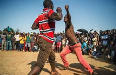 africa south christmas boxing knuckle bare african tournament fight every holds province fighting people blood fights rural knock surrender tribe