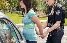 female cop handcuffs woman women young handcuffed arrested police wrists stock saved cuffed uniform