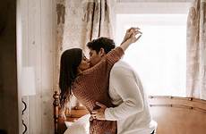 hotel honeymoon room couples photoshoot cute kissing unforgettable memories couple bed romantic love poses hotels wedding photography inspi engagement choose