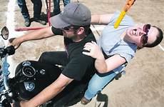 rodeo motorcycle bikers skills show billingsgazette tries bite pope karen schimmer adam hanging keep while dog take his hot