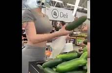 woman hot buying cucumbers mask face