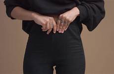 pants hand touching waist womans woman stock closeup
