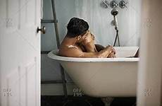 couple bathtub kiss kissing young lying bath tub offset model cuddles fr questions any long