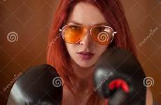 gloves boxing woman red sunglasses upset looks pretty hair young preview anger female stock