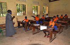 uganda school schools finally back masks strict distancing operating guidelines covid physical wearing under face