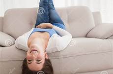 upside down couch lying brunette pretty room stock
