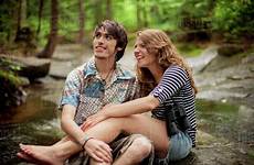 couple barefoot forest sitting boulders dissolve stock d145