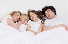 sleeping family together two same bed indoors preview