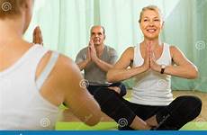 yoga mature instructor practicing couple preview