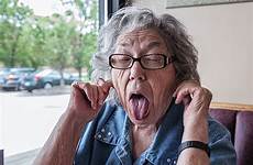granny tongue grandma sticking oma zunge ears stockfotos