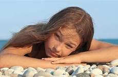 beach young girl lying sea smiling portrait preview pebble stock