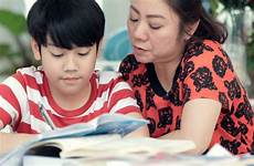 son mom teaches mother asian homework doing genius serious living