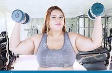 woman lifting gym obese dumbbells fitness preview