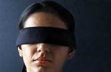 blindfolded woman look way other