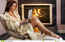 fireplace woman hot laptop front computer bathrobe leisure sitting enjoying winter using stock shutterstock