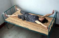 torture tied bed her women handcuffed cuffed gong forced stretched falun minghui after nurse hospital mental enactment ms re labor