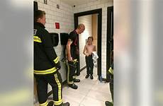 stall bathroom stuck boy toilet after kfc food faulty firefighters traps rescue lock him goss zac chain fast half cut
