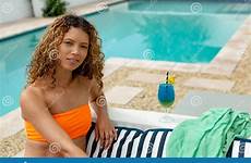 pool bikini backyard woman swimming near relaxing front mixed race hair stock preview