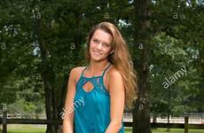 teen farm girl poses beautiful sitting girls while fence wooden jeans alamy stock blouse
