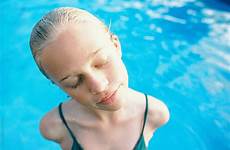 wet teen pool blonde hair swimming short stocksy portrait laurel wendy