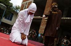 woman indonesian public sex women having whipped she caned indonesia marriage man outside child sharia young her passes breaking whipping