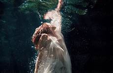 underwater woman surface reaching water swimming drawing stocksy girl photography ocean floating upward deep mermaid body perfect