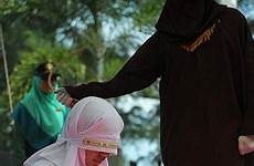 punishment caned allowed woman brutal women adultery men caning muslim man times law province majority sharia populous implement islamic country