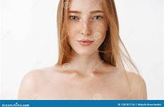 freckles redhead naked woman close over feminine posing attractive gray shot background eyes preview