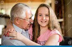 grandfather hug happy granddaughter hugging elderly preview