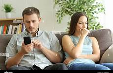 phone husband his watching addicted beside worried alamy smart