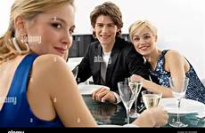 dinner teenage alamy boy young party two women