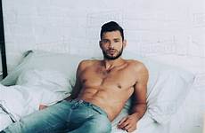 bed shirtless man jeans muscular handsome posing dissolve stock lightfield d2115