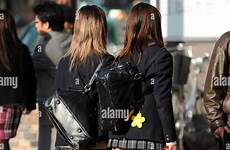 japanese school girls tokyo walking shinjuku alamy