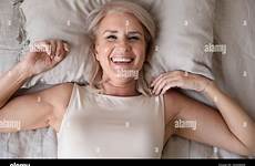 bed woman older mature happy stock alamy sleep alone sleeping wake top