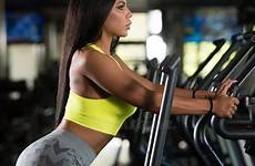 latina fitness gym women elliptical treadmill girl stock moonwalker exercising equipment preview