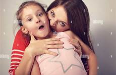 mother bite emotional angry wanting capricious naughty alamy young her