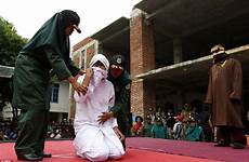 woman public sex caned indonesian having punishment young muslim whipped outside marriage being whipping her stage aceh man she knees
