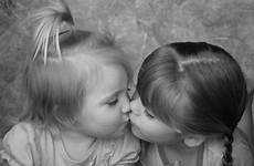 sisters kissing two stock