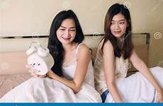 lesbian asian clock alarm female look women beautiful preview
