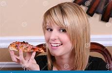 pizza eating sweet girl stock