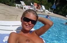 sunbathing topless poolside smutty
